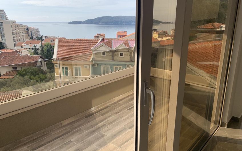 Two-bedroom apartment with sea view and pool in Rafailovići, 67 m²